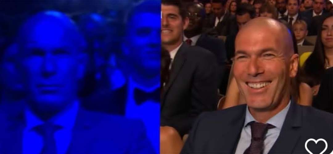 a man in a suit and tie is smiling